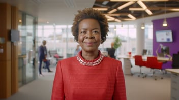 A woman in a office speaking to camera as part of a talking head interview filmed by BearJam
