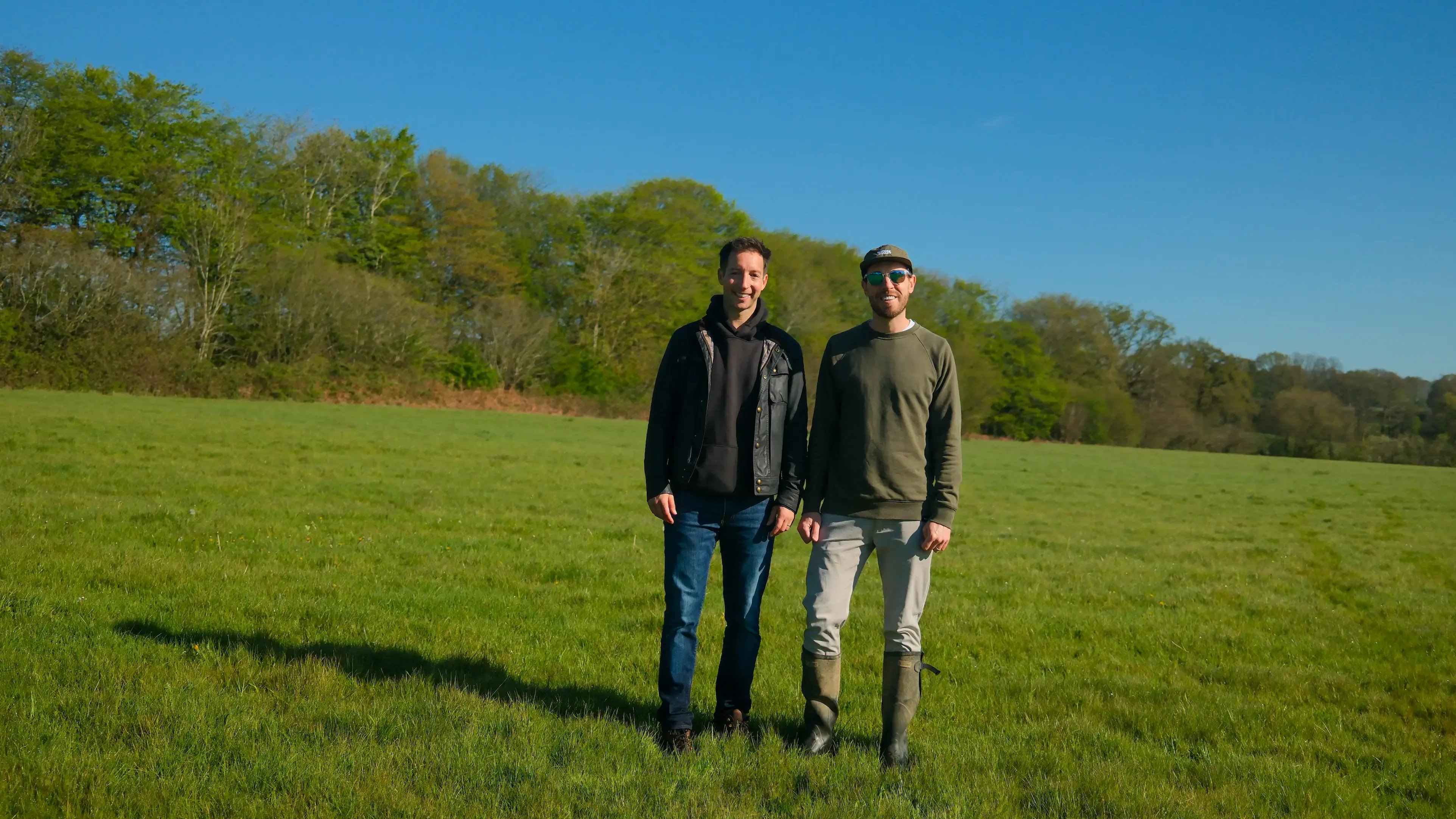 James Hilditch and Tom Nelson standing in a field